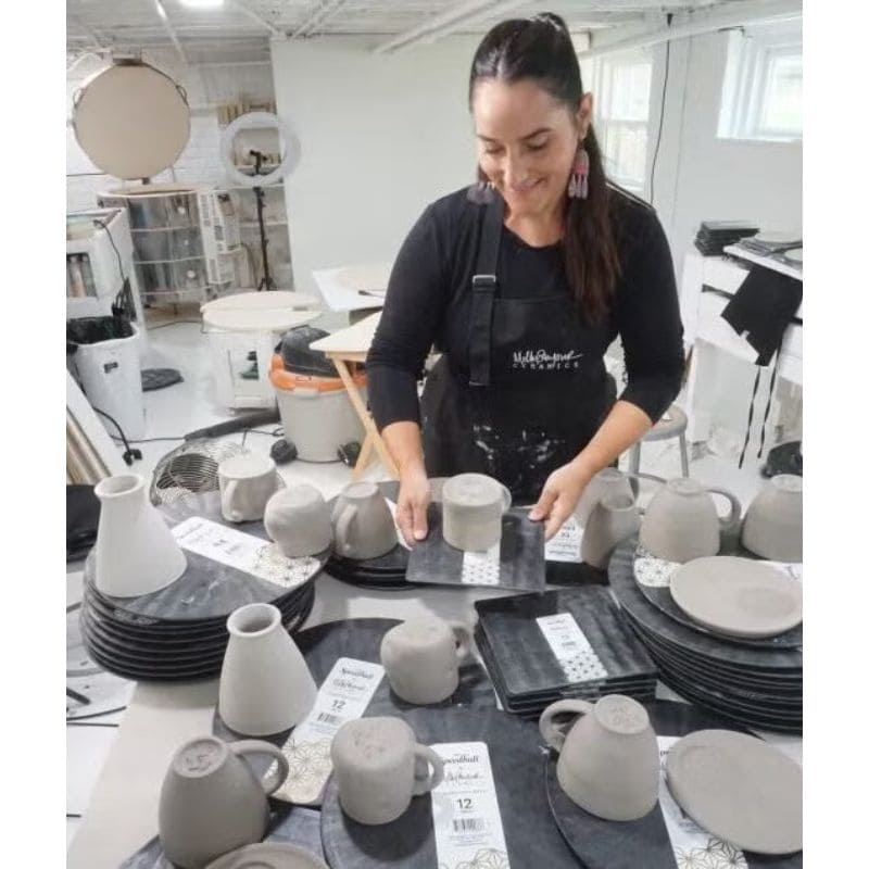 artist molly signor working with clay creations using a variety of Speedball Art plastic pottery wheel bats