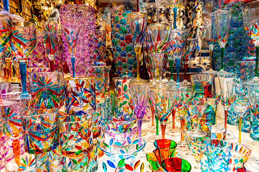 Close-up window display of colored glass fused artwork