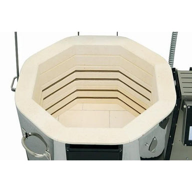 Close-up top-down view into top-loading firebrick-constructed interior firing chamber of Evenheat GTS 23 Glass kiln with electronic box-controller on right side.