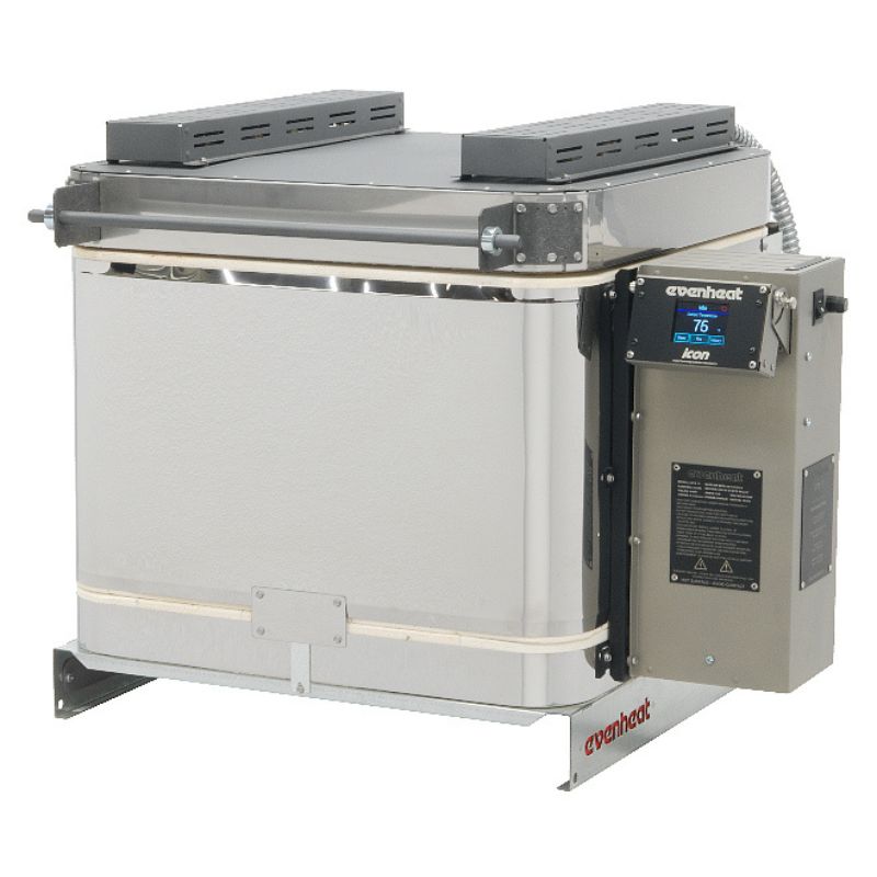 Slightly left-angled front view of closed top-loading GTS 17 glass kiln from Evenheat, with electrical box and temperature controller on right side of kiln, all sitting on a short metal base made ideal for benchtop placement.