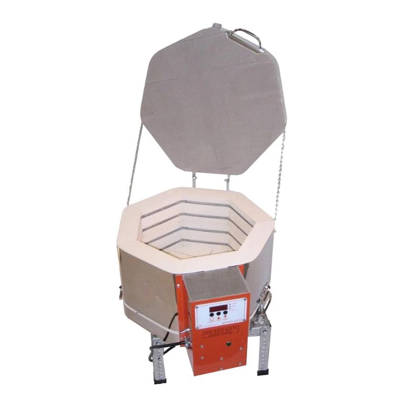 Topdown view of opened, round-shaped AF3C 15/9 ceramic/pottery kiln from Jen-Ken sitting on a small metal stand, showing the Orton AutoFire AF3C (AF4X) 3-Button controller.