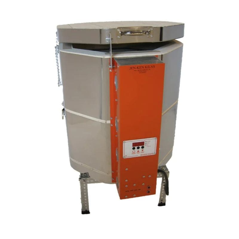 Slightly righ-angled, slightly opened, round-shaped AF Mega-Coil 1822 Ceramics and Pottery kiln from Jen-Ken, with an Orton AutoFire AF3C (AF4X) 3-Button controller and sitting on a small metal stand.