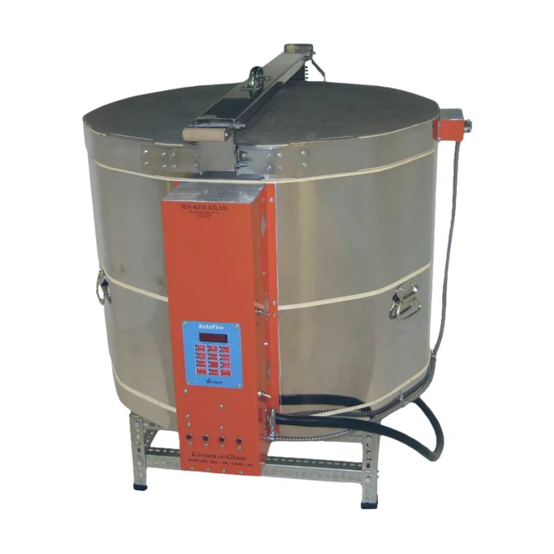 Slightly left-angled, closed, round-shaped AF Ceram-A-Glass 2822 ceramics and glass kiln from Jen-Ken, featuring 3" chamber brick and showing the electrical box with Orton AutoFire 4000 12-button controller while sitting on a short metal stand.
