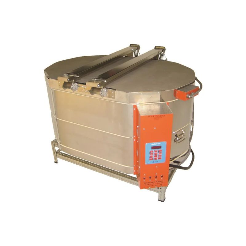 Left-angled view of closed, oval-shaped AF Ceram-A-Glass kiln from Jen-Ken ideal for ceramics, glaze firings, and glass fusing, slumping, and annealing. It's on a short metal stand and showing the electrical box with an Orton AutoFire 4000 12-button controller.