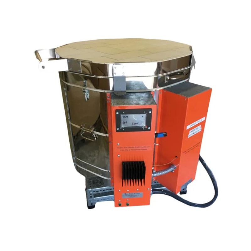 Left-angled view of closed, round-shaped AFG double wall crucible glass kiln from Jen-Ken with electrical boxes visible, and controller on front box.