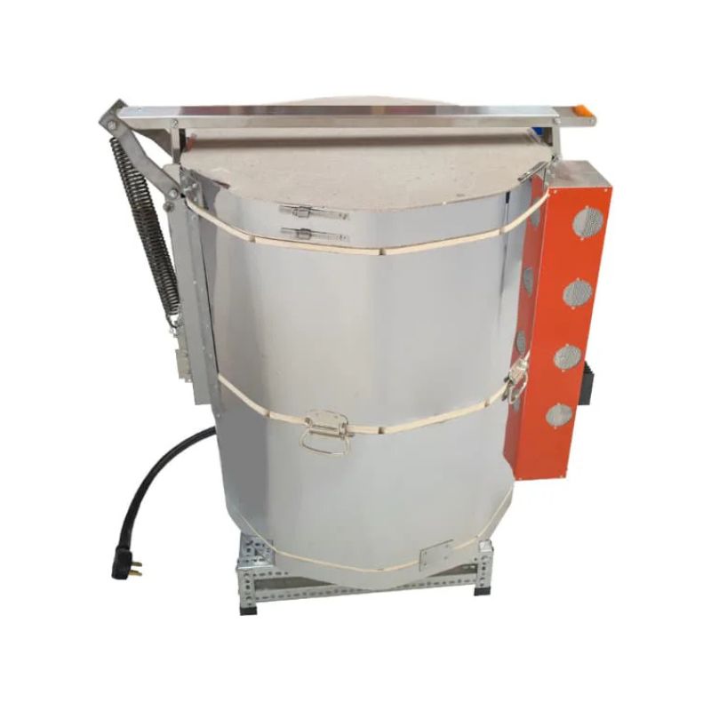 Right-facing side view of closed, round-shaped AF Mega-coil 2413 ceramics and pottery kiln from Jen-Ken with 3" chamber brick, sitting on a small metal stand and showing the lid assist hinge and mechanism and the side of the electrical box.