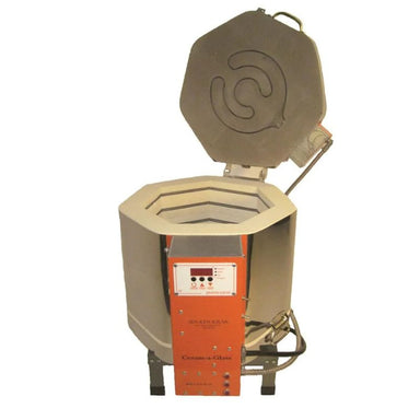 Slightly left-angled view of opened, round-shaped AF dual-media Ceram-A-Glass 1513 ceramics and glass kiln from Jen-Ken, sitting on a small metal stand, showing the electrical box with Orton AutoFire AF3C (AF4X) 3-Button controller.