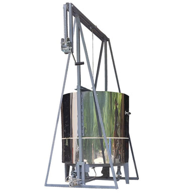 Side view of closed Olympic Kilns 28" Raku updraft gas kiln set up a metal burner frame.