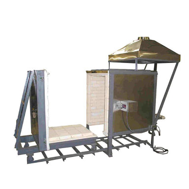 Side view of left-facing Olympic Kilns large capacity downdraft gas kiln - DD17 model - with sliding floor and front door opened and moved down a 6-foot car track. Also shows the digital temperature controller and steel vent hood.