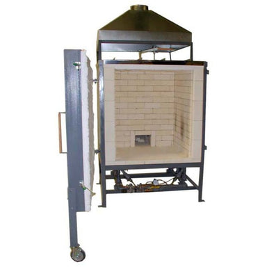 Interior view of Olympic Kilns large capacity DD20 gas kiln with side-hinged door open to the left and steel venting hood attached above.