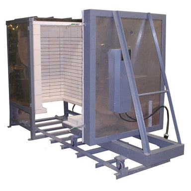Front view of Olympic Kilns FL20E large capacity Car Kiln with removable floor and door opened and shifted down a 6-foot track.