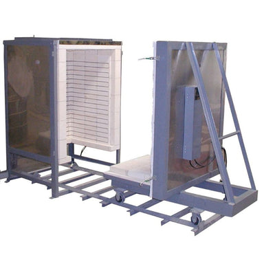 Front angled side view of opened Olympic Kilns FL31E Large Capacity Car Kiln with removable floor and door slid down to far right end of 6-foot track with partial view inside 31-cubic-foot firing chamber on left.