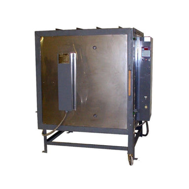 Front view of closed Olympic Kilns FL36E Large Capacity Kiln on metal stand with dedicated breaker box on the door and electrical box and controller on the kiln's right side.