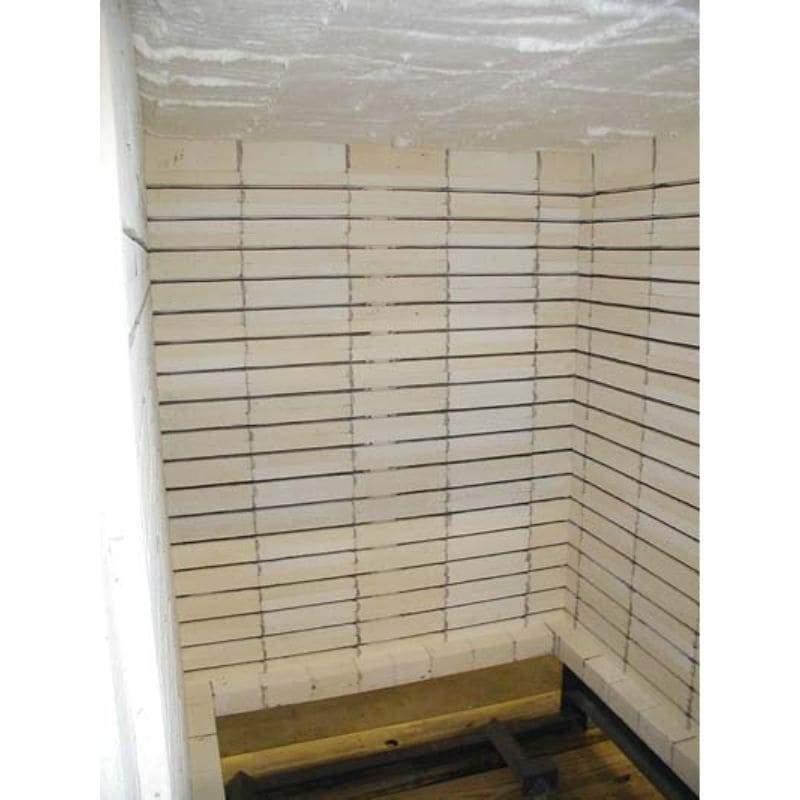 Fully interior view of interior firing chamber of Olympic Kilns FL42E Car Kiln showing 4.5-inch brick. Stationed on top of pallet, viewable as floor and front door is not viewable as they are slid down the 6-foot track.