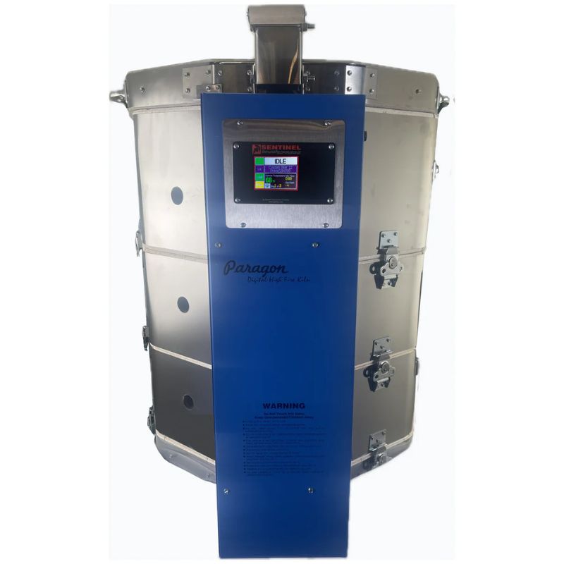 Front-facing view of closed, 10-sided round-shaped CT102329 Janus ceramics and glass kiln from Paragon with the Paragon Blue-colored electrical box with SENTINEL Smart Touch Controller digital controller right in front.