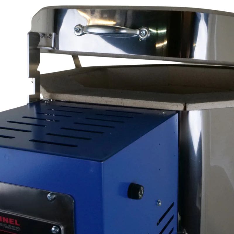 Close-up view of the lid held in a slightly-opened position on a top-loading Ceramics and Pottery Kiln from Paragon. Lid handled is just above the top of the Paragon Blue-colored electrical box.