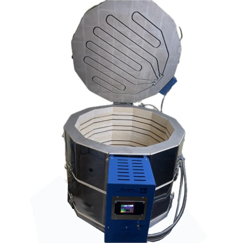 High-angled, straight-on view of opened, 12-sided round-shaped CT122822 ceramics and glass kiln from Paragon with the Paragon Blue-colored electrical box with Sentinel TouchExpress digital controller right in front.