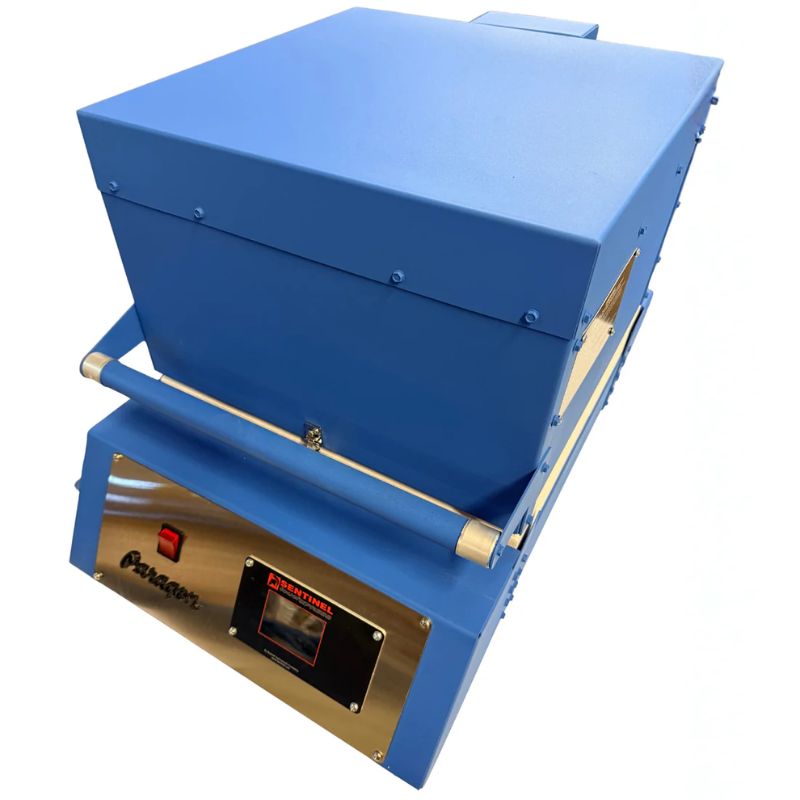 High angled view of closed Paragon CSF12 Glass Fusing Kiln in Paragon Blue color, showing the Sentinel TouchXpress controller beneath door and handle.