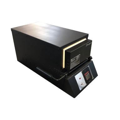 Closed KM24 Double Barrel Knife Making kiln from Paragon Kilns, in black color, with door handle on left and Sentinel TouchXpress controller beneath door.