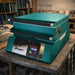 Opened, slightly-angled TLC16 glass fusing kiln from Paragon, painted in Jade showing Sentinel TouchXpress digital controller... set in a real-life environment.