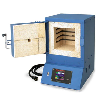 Slighly left-angled, opened Q11 dual-media, multipurpose kiln from Paragon, colored in Paragon Blue showing the interior chamber and it's side-wall heating elements. Controller at bottom of kiln below left-side hinged front-loading door.