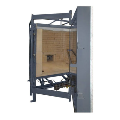 Interior view of downdraft olympic Kiln showcasing a new rotating door mechanism