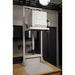 Front-angled view of closed HS-7GV Vitrigraph Glass kiln from Hot Shot  placed on and raised up on Hot Shot's motorized VitriLift Electric Vitrigraph Lift - all within a studio environment.